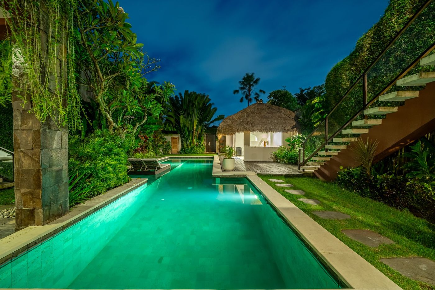 Villa Amerta A swimming pool and garden at dusk, Berawa Canggu