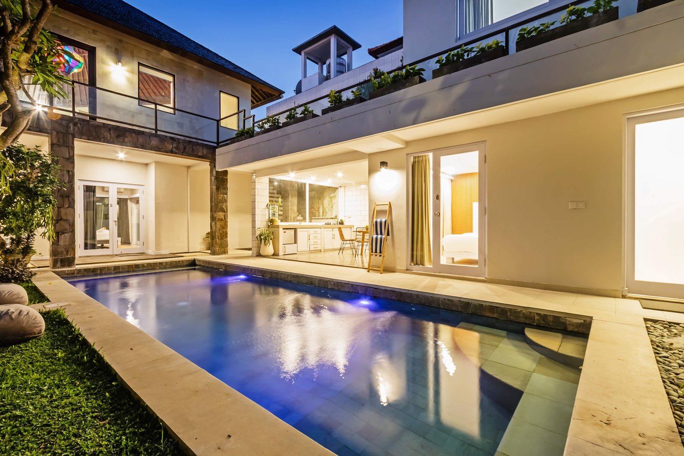 Villa Amerta B and the pool lit at dusk, Berawa Canggu