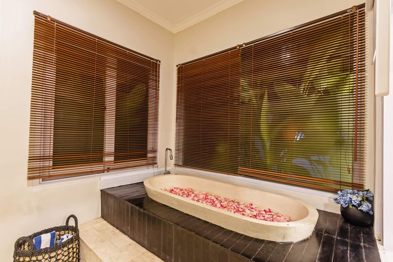 Stone bath filled with flower petals