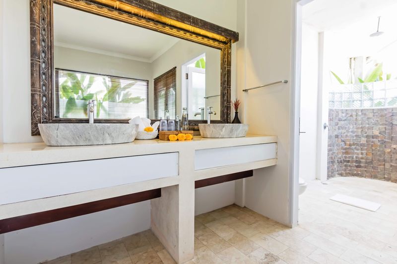 Ensuite with twin vanity and carved mirror